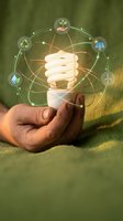 Hand holding a glowing energy-saving bulb with green eco icons, symbolizing renewable energy, sustainability, and environmental innovation.