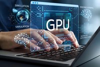 Professional working on laptop with GPU computing interface displaying advanced graphics processing technology for machine learning applications.