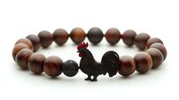 Brown wooden beaded bracelet with black decorative rooster charm and textured accent bead, displayed on white background for jewelry and accessory design.
