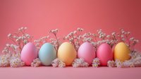 Colorful Easter eggs in pastel shades arranged with delicate white flowers on pink background for spring holiday celebration and festive decoration.