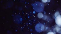 Abstract blue bokeh lights on dark background creating dreamy atmosphere for holiday celebrations, party events, and festive decorations.