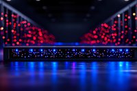 Glowing red and blue bokeh lights create dramatic nightclub atmosphere with illuminated stage platform and reflective floor surface for entertainment background.