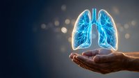 Human hands holding glowing blue lungs with bronchial tree structure against dark background with bokeh lights for medical healthcare concepts.