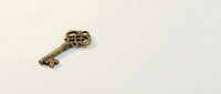 Vintage ornate brass key with decorative scrollwork handle isolated on white background for antique design projects.