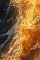Dynamic orange and black liquid abstract with swirling patterns and floating particles creating dramatic contrast and flowing movement on dark background.