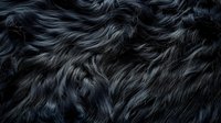 Dark wavy fur texture with long black and gray animal hair creating natural photography for background and design projects.