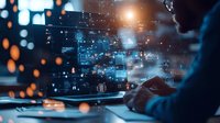 Professional working on laptop with futuristic holographic interface displaying data analytics, digital transformation concept in dark office with bokeh light effects.
