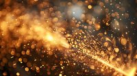 Glowing golden sparks and bokeh lights create dynamic motion against dark background, abstract magical atmosphere for festive designs and celebrations.