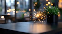 Magical glowing sparkles floating above dark table with bokeh lights and potted plant in background, creating mystical atmosphere for fantasy designs.
