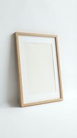 Empty wooden picture frame with white mat leaning against wall, ready for artwork display and home decoration projects.