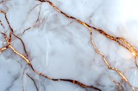 Luxurious white marble texture with golden veins creating elegant natural pattern. Abstract stone surface background for interior design and architecture.