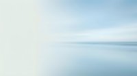 Serene minimalist seascape with soft blue sky and calm ocean waters creating peaceful horizon line for meditation and wellness concepts.