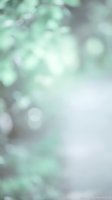 Abstract mint green bokeh background with soft blurred lights and dreamy atmosphere for spring designs and fresh natural concepts.