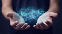 Man holding glowing digital network energy between open palms, representing technology, innovation, data connection, and wireless communication for business solutions.
