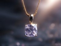 Elegant cushion-cut crystal pendant on gold chain necklace against blurred background with soft bokeh lights, showcasing luxury jewelry design and craftsmanship.