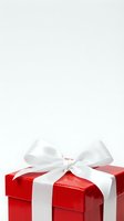 Red gift box with white satin ribbon bow on white background, isolated present for holidays, birthdays, celebrations, and special occasions design use.