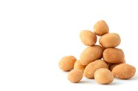 Fresh brown chicken eggs stacked in pyramid shape on white isolated background, natural organic farm produce for cooking and baking.