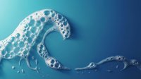 Foamy ocean wave with white bubbles and splash on blue gradient background for marine and water themed designs.