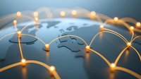 Glowing network connections on world map with illuminated nodes showing global connectivity and international business communications concept.