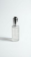 Elegant glass serum bottle with silver pump dispenser isolated on white background for skincare and cosmetic product packaging design.