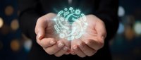 Businessman hands holding glowing digital brain with circuit patterns representing artificial intelligence and machine learning technology concepts.