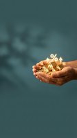 Hands holding glowing miniature houses with percentage symbols representing real estate investment, mortgage rates, and property market growth opportunities.