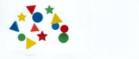 Colorful geometric shapes including stars, circles and triangles in red, blue, yellow and green on white background for educational and design projects.