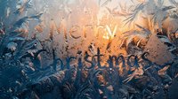 Merry Christmas text written on frosted window glass with golden sunset light glowing through intricate ice crystal patterns in winter.