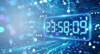 Digital countdown timer displaying 23:50:09 on futuristic circuit board background with glowing blue lights and bokeh effects for technology concepts.