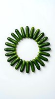 Fresh green cucumbers arranged in a circular pattern on white background, isolated and ready for design use in food, agriculture, and healthy eating projects.