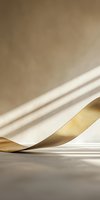Elegant curved paper sheet in white and gold colors with dramatic shadows on neutral background, creating minimalist abstract composition with flowing lines.