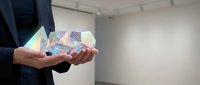 Professional businessman holding holographic geometric shapes displaying data visualization and digital analytics in modern office environment.