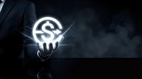 Businessman holding glowing dollar sign symbol with sparkling light effects against dark background, representing financial success, money management, and wealth creation.