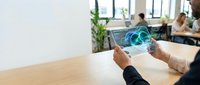 Businessman using tablet with holographic global network interface in modern office workspace for digital transformation and connectivity solutions.