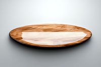 Empty wooden plate with natural grain pattern on gray background, round serving dish isolated for food presentation and restaurant menu design.