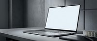 Modern laptop computer with blank white screen on minimalist desk in contemporary office workspace for business presentations and mockup designs.