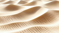 Smooth sand dunes with gentle ripples and curves creating abstract natural patterns in warm beige tones, lit by soft directional light casting delicate shadows.