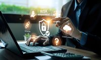 Professional businessman managing cybersecurity risk assessment with digital security icons and compliance analytics on laptop computer for corporate protection.