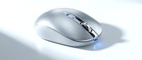 Sleek silver wireless computer mouse with blue LED light on white background, modern ergonomic design for tech, office, and digital workspace concepts.