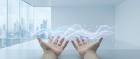 Hands presenting digital data visualization with glowing network connections in modern office space overlooking city skyline for business analytics.