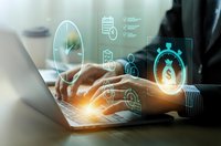 Businessman hands typing on laptop with glowing cybersecurity icons and digital lock symbols representing data protection and network security technology.
