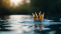 Golden crown floating on rippling water surface with sunlight creating magical atmosphere, royal symbol emerging from blue depths. Perfect for fairy tale concepts.