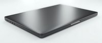 Sleek modern laptop closed on white background, isolated for design use. Dark gray portable computer side view, minimalist tech device.