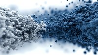 Blue and white powder particles creating dynamic wave formation with scattered granules on clean background for cosmetic and chemical applications.