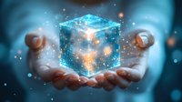 Glowing blue holographic cube floating above open palms with magical light particles and bokeh effects against dark background creates futuristic technological atmosphere.