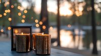 Copper mercury glass candles glowing at dusk on outdoor table with bokeh lights and lake view, creating warm ambiance.