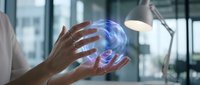 Professional woman holding glowing digital brain hologram in modern office environment representing artificial intelligence and future technology innovation.