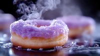 Fresh glazed donuts with purple icing releasing steam on dark surface. Sweet bakery treats with colorful frosting perfect for cafe menus and food advertising.