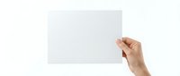 Hand holding blank white paper sheet against white background isolated for mockup design and presentation templates.