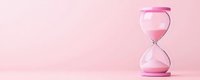 Pink hourglass with flowing sand on soft pink background symbolizing time management, deadlines, and productivity concepts for business presentations.